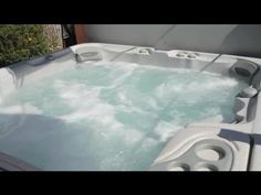 an outdoor hot tub is shown with water in it