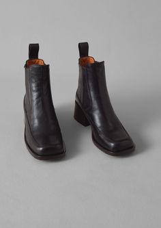 Our Black Chie Mihara Lotte Leather Boots are designed by TOAST and handcrafted in Spain. They have elasticated sides, a square toe and block heel. Leather Boots Black, Alias Mae, Linen Tableware, Plastic Heels, Square Toe Boots, Shoe Gifts, Hot Mess, Leather Boot, Designer Boots