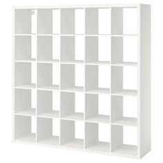 a white bookcase with many cubes on it's sides and one section missing