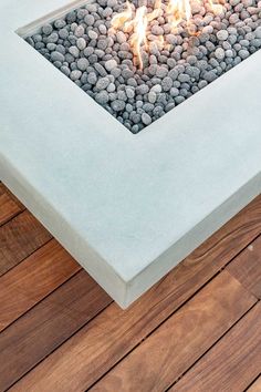 an outdoor fire pit with rocks in the middle