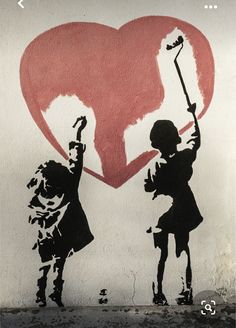 a painting on the side of a building depicts two children holding up a heart with an arrow