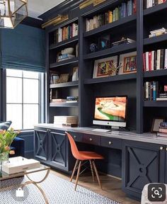 a living room filled with furniture and bookshelves