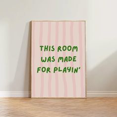 this room was made for playin'print in pink and green on a white wall