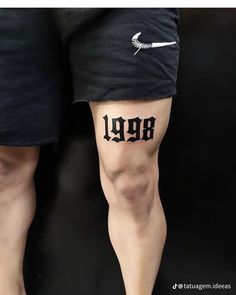 two people with tattoos on their legs and one has the word leg written in black ink