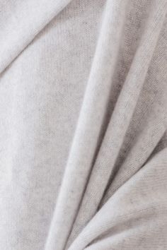 a close up shot of the fabric on a white shirting material that is very soft