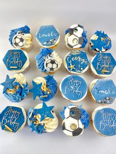 cupcakes with blue frosting and soccer decorations