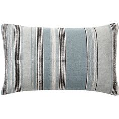 a blue and white striped pillow on a white background