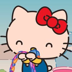 the hello kitty character is drinking water from a faucet in front of her