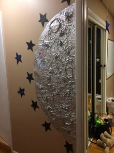 an image of the moon and stars painted on a wall in a child's room