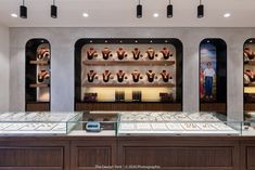 the inside of a jewelry store with glass cases