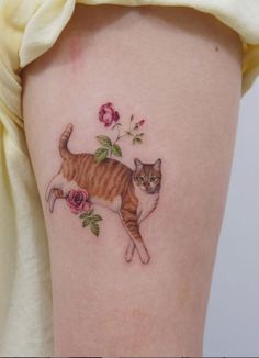 a cat with flowers on it's back leg