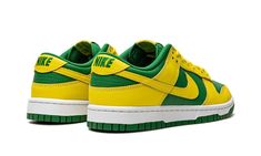 The Nike Dunk Low “Reverse Brazil” is a two-tone, yellow-and-green colorway of the retro basketball shoe that flips the color scheme of the model’s popular “Brazil” style.  As its name suggests, the “Reverse Brazil” reverses the color coordination of the “Brazil” Dunk, and it doesn’t miss the mark.  The shoe features Yellow Strike leather overlays and Swoosh branding on an Apple Green-colored leather base.  A green “Nike” logo is embroidered on the yellow leather heel tab.  Classic “Nike” detail Nike Dunk Low Reverse Brazil, Yellow And Green Dunks, Green And Yellow Sneakers, Green And Yellow Shoes, Reverse Brazil Dunks, Yellow Shoes Aesthetic, Nike Dunk Low Brazil, Yellow Nike Shoes, Brazil Style