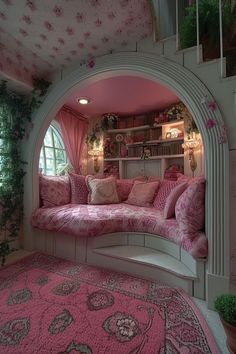 a living room with pink and white decor on the walls, rugs and shelves