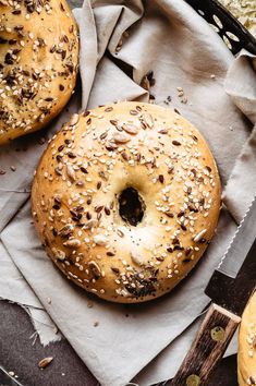 two bagels sitting on top of a piece of paper