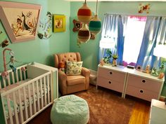 a baby's room is decorated in pastel colors