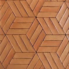 a close up view of a wall made out of wood planks, with different patterns on it