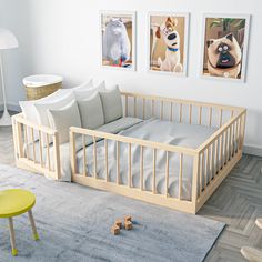 a child's room with three pictures on the wall and a baby crib