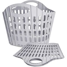 a large metal grate sitting on top of a white floor next to another grate