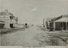 an old black and white photo of some buildings