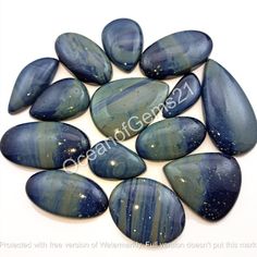 blue agatete stones with white speckles on them, arranged in a circle