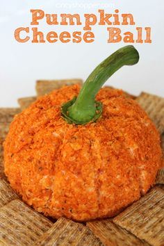 a pumpkin cheese ball on top of crackers with the words pumpkin cheese ball above it