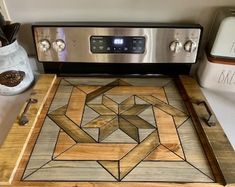 a wooden cutting board sitting on top of a stove