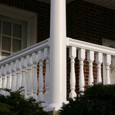 a white railing on the side of a house