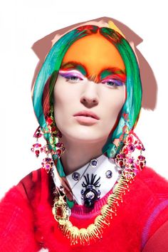 a woman with bright hair and colorful makeup