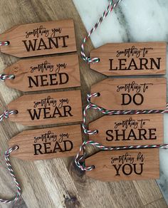 four wooden signs that say, do something you want to learn and don't