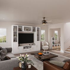 a living room filled with furniture and a flat screen tv