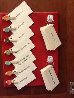 a bulletin board with several pieces of paper pinned to it and magnets attached to them