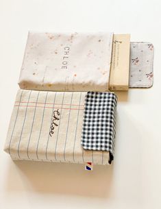 three folded cloths on top of each other with the words coffee printed on them