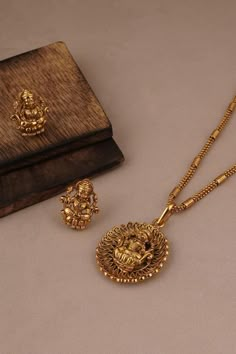 Buy Smars Jewelry Goddess Lakshmi Carved Pendant Necklace Jewellery Set Online | Aza Fashions Lakshmi Devi Locket Gold Simple, Lakshmi Locket Gold, Lakshmi Dollar Gold, Gold Lakshmi Pendant Designs, Beats Jewellery, Simple Gold Pendant Necklace, Dollar Chain