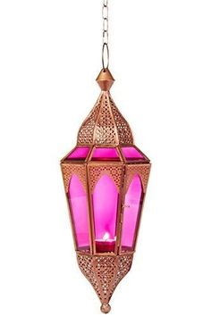 a pink light hanging from a chain