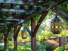 two colorful lanterns hanging from a wooden pergoline