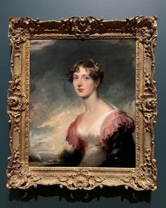 a portrait of a woman in a pink dress