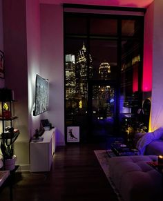 a living room filled with furniture and a flat screen tv sitting on top of a wooden floor