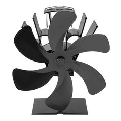 a black and white photo of a metal sculpture with four blades in the shape of a propeller