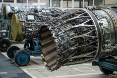 an airplane engine being worked on in a factory