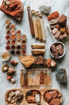 an assortment of rocks and spices on a table