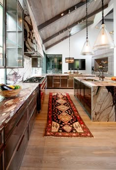 a kitchen with an area rug on the floor