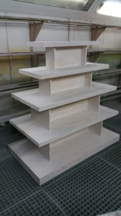 several white shelves stacked on top of each other