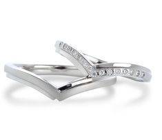 two white gold wedding rings with diamonds