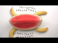 a watermelon and banana cut in half to look like a turtle