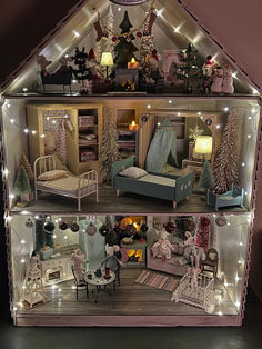 a doll house with lights and furniture inside