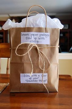 a brown bag with some writing on it and a tag that says, bag of his favorite things i diy valentine's for boyfriend