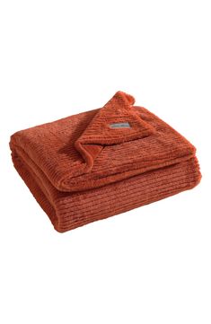 an orange blanket folded on top of each other