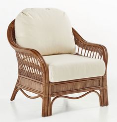 a wicker chair with a white cushion on it's back and armrests