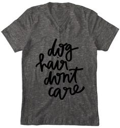 a t - shirt that says dog hair don't care in black ink on a gray background