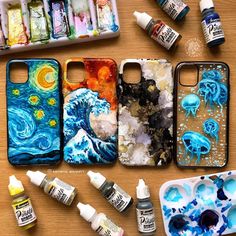 the contents of an iphone case sitting on top of a table next to paint bottles